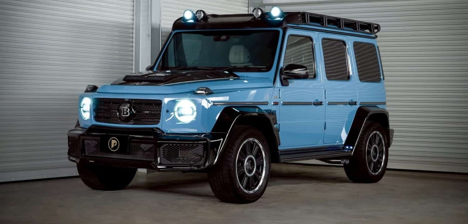 เช่า G Wagon Brabus D40 Adventure สี Vintage Blue มุมหน้า 3/4 เต็มคัน ไฟหน้าเปิด — Prime Cars Rental G-Class rental Bangkok Thailand