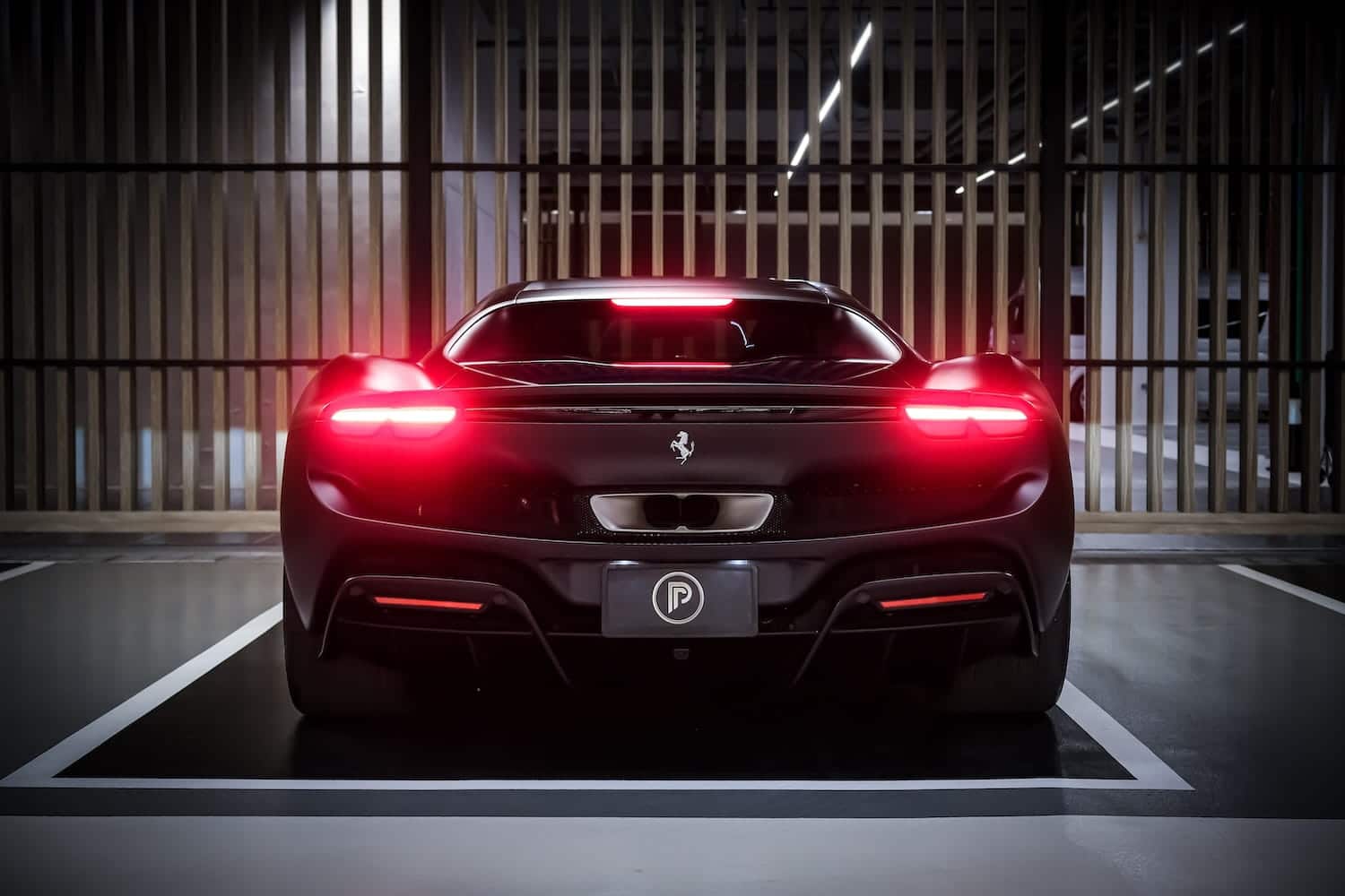 Ferrari 296 GTB Matte Black rear tail lights — Prime Cars Rental Bangkok | Ferrari 296 GTB สีดำด้าน มุมท้าย ไฟท้าย
