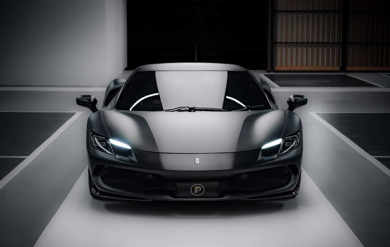 Ferrari 296 GTB Matte Black front view — Prime Cars Rental Bangkok | Ferrari 296 GTB สีดำด้าน มุมหน้า