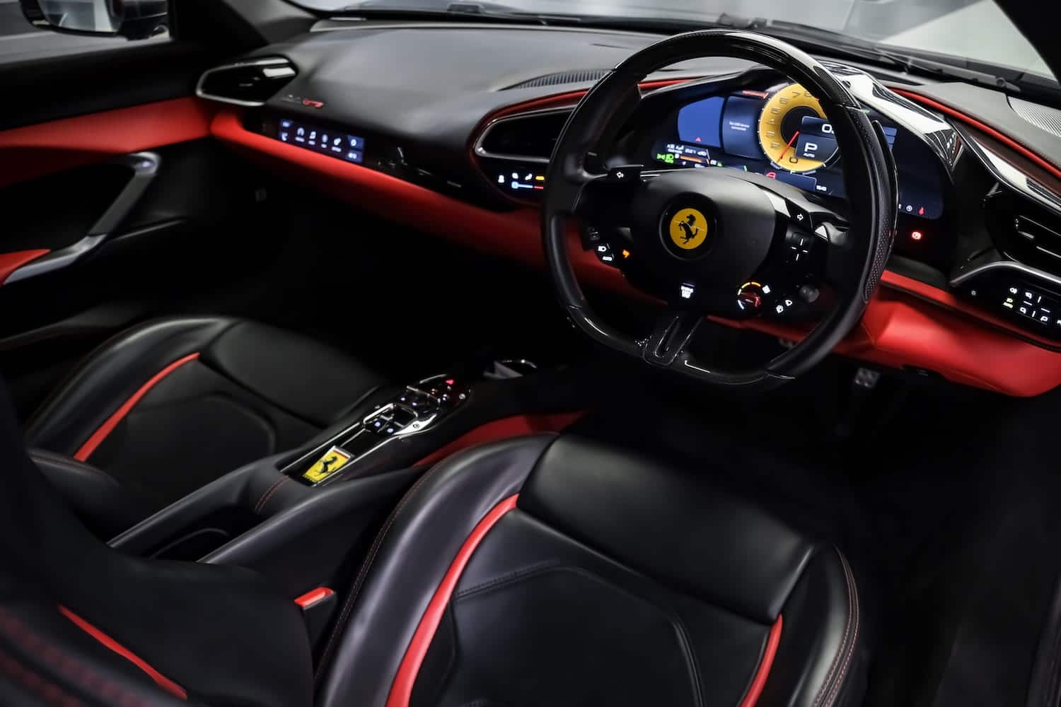 Ferrari 296 GTB Matte Black interior with red accents — Prime Cars Rental | ภายใน Ferrari 296 GTB สีดำ ตกแต่งสีแดง