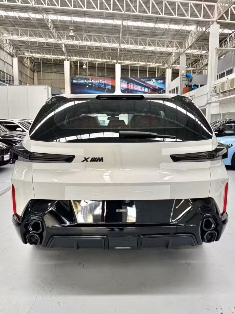 BMW XM 50e rear high angle showing stacked hexagonal exhaust tips